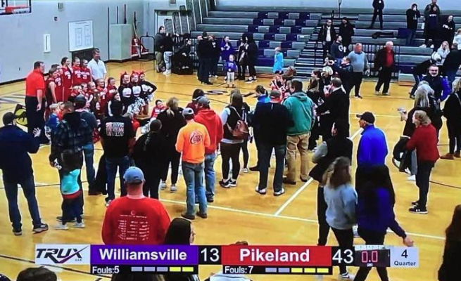 williamsville vs pikeland basketball game on tv screen 